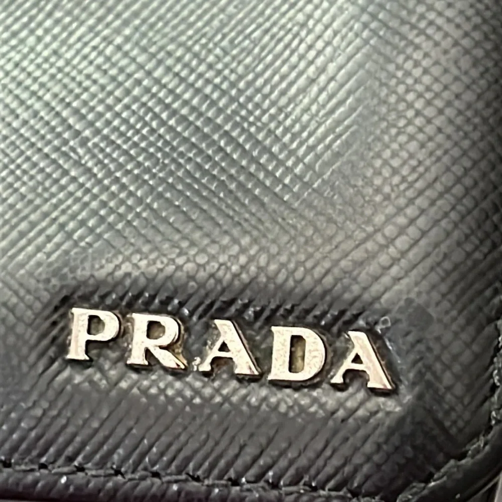 Prada black saffiano leather bifold wallet